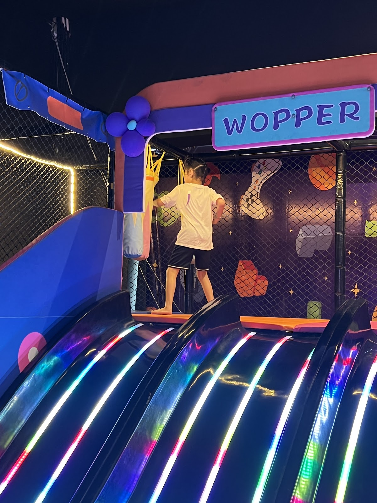 Top view of LED rainbow slide under Wopper sign